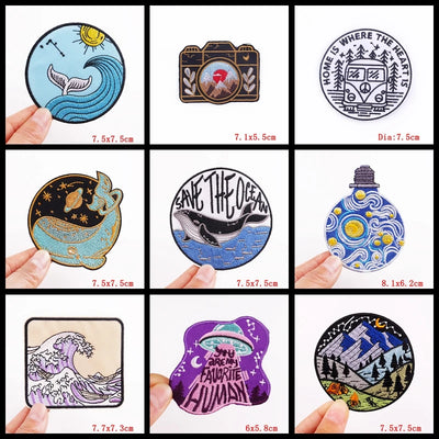 Collection of various stickers with different designs held by hands, displayed against a white background.