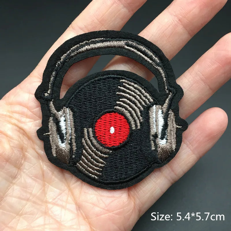 Embroidered patch of headphones with a red circle on a hand, size 5.4*5.7cm.