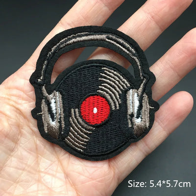 Embroidered patch of headphones with a red circle on a hand, size 5.4*5.7cm.