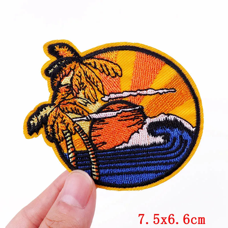 Embroidered patch of a fisherman with a fish on a white background