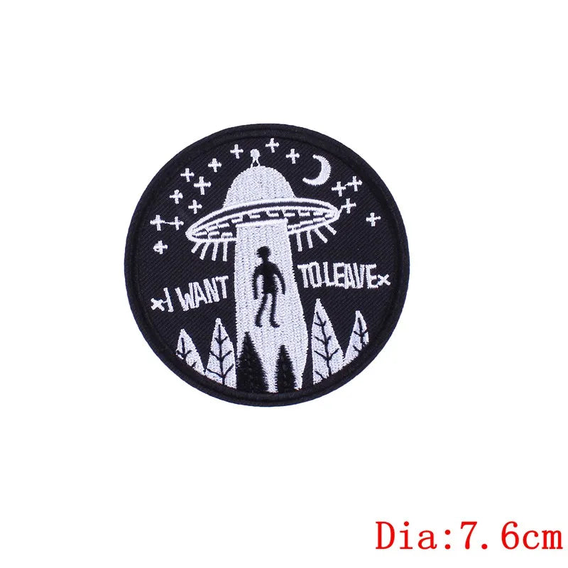 Circular patch with UFO design and text 'I Want to Leave' on a white background