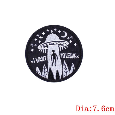 Circular patch with UFO design and text 'I Want to Leave' on a white background