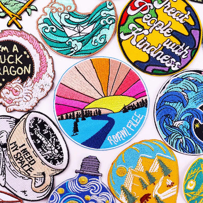 Collection of colorful embroidered patches with various designs and text.