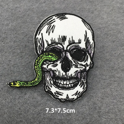 Skull with a green snake on a gray background