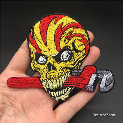 Skull with red hair and wrench held in hand against a dark background