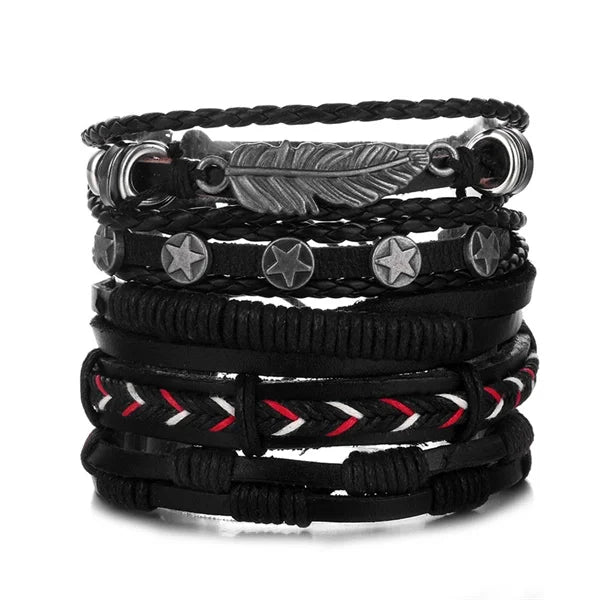 Set of black leather bracelets with feather and star charms on a white background