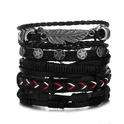 Set of black leather bracelets with feather and star charms on a white background