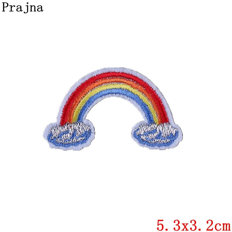Colorful rainbow patch with clouds on a white background, featuring the brand 'Prajna'.