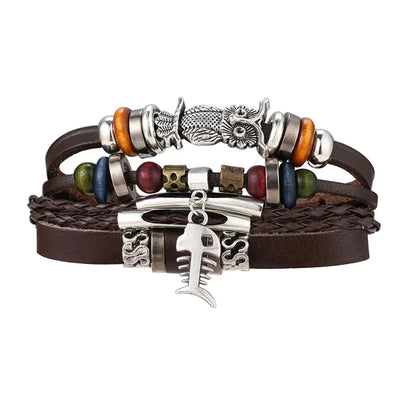 Multistrand leather bracelet with various charms on a white background