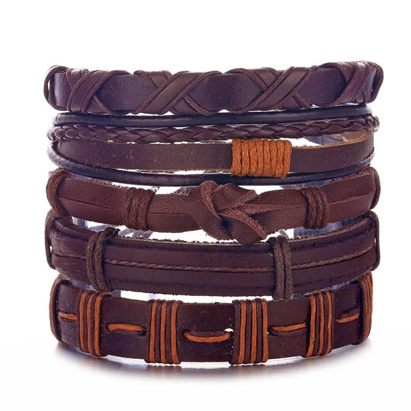 Stack of brown leather bracelets on a white background