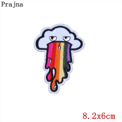 Colorful cloud-shaped patch with rainbow design on a white background, branded 'Prajna'.