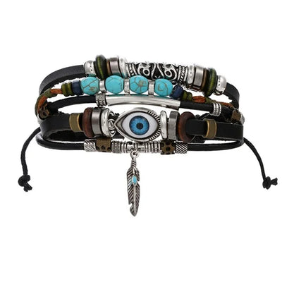 Multi-layered bracelet with beads and eye charm on a white background