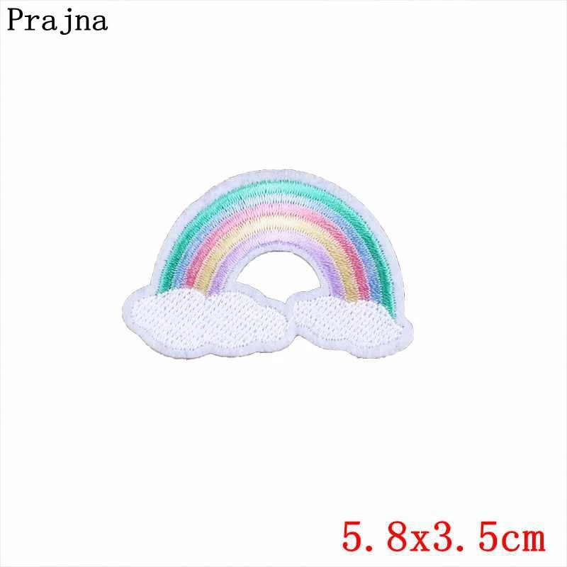 Colorful rainbow patch with clouds on a white background, featuring the brand 'Prajna'.