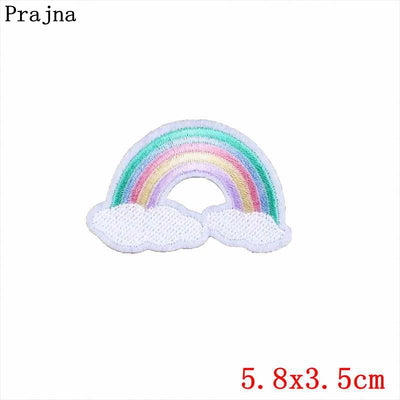 Colorful rainbow patch with clouds on a white background, featuring the brand 'Prajna'.
