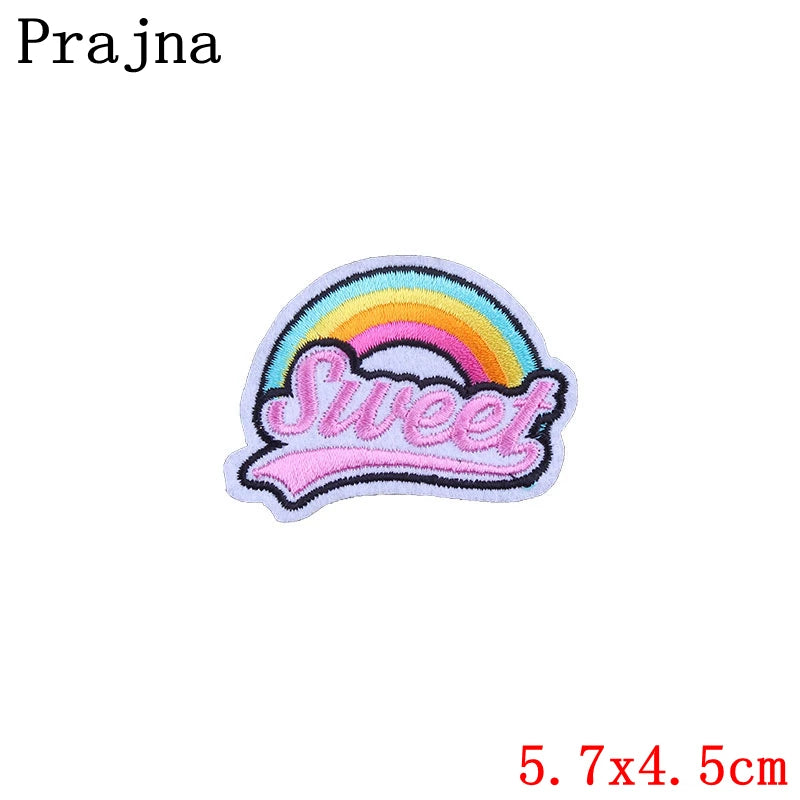 Embroidered patch with rainbow and 'Sweet' text on a white background