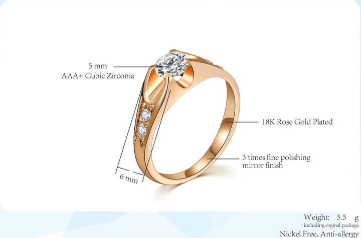 Rose gold-plated ring with cubic zirconia stones on a white background