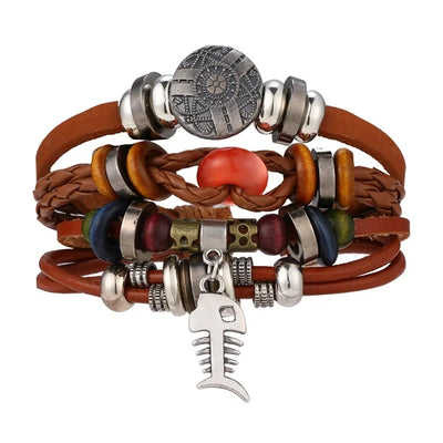 Multistrand leather bracelet with metal beads and charms on a white background