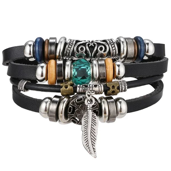 Multistrand bracelet with various charms on a white background