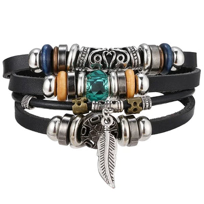 Multistrand bracelet with various charms on a white background