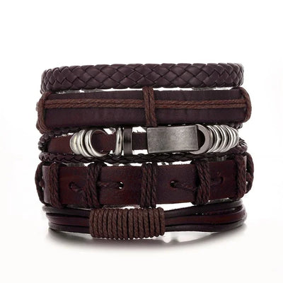 Stack of brown leather bracelets with metal accents on a white background