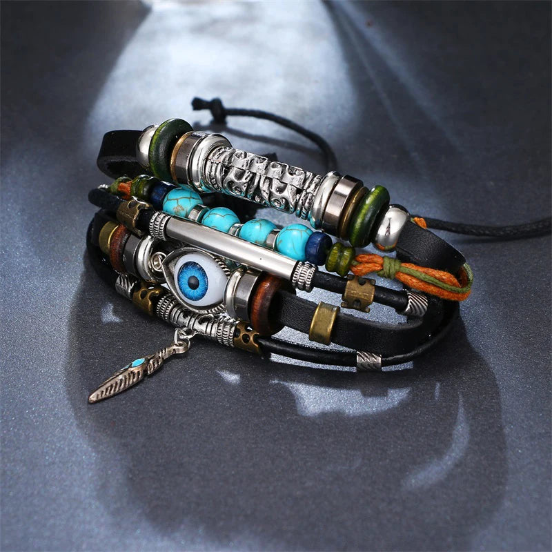 Multistrand bracelet with beads and charms on a gray surface