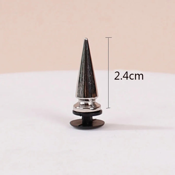 Black and silver spike with measurement label on a beige background