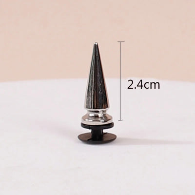 Black and silver spike with measurement label on a beige background