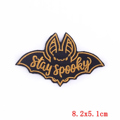 Bat-shaped patch with 'Stay Spooky' text on a white background