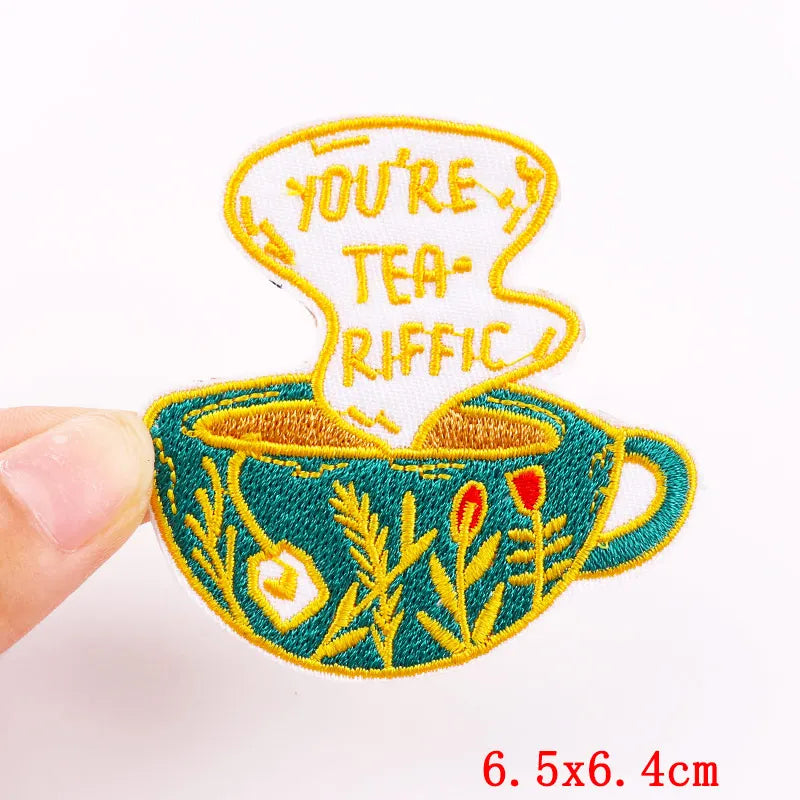 Embroidered patch with a teacup design and 'You're Tea-Riffic' text on a white background.