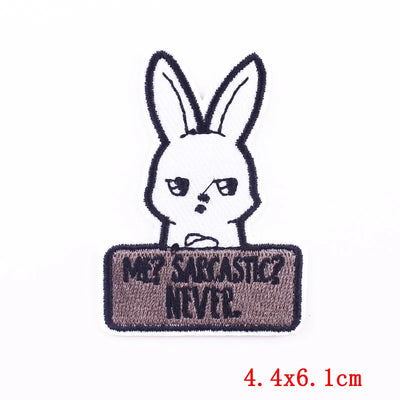 Embroidered patch with a cartoon rabbit and text on a white background