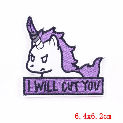 Embroidered patch with a unicorn design and text 'I WILL CUT YOU' on a white background.