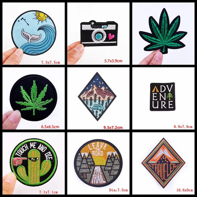 Collection of various embroidered patches with different designs and sizes.