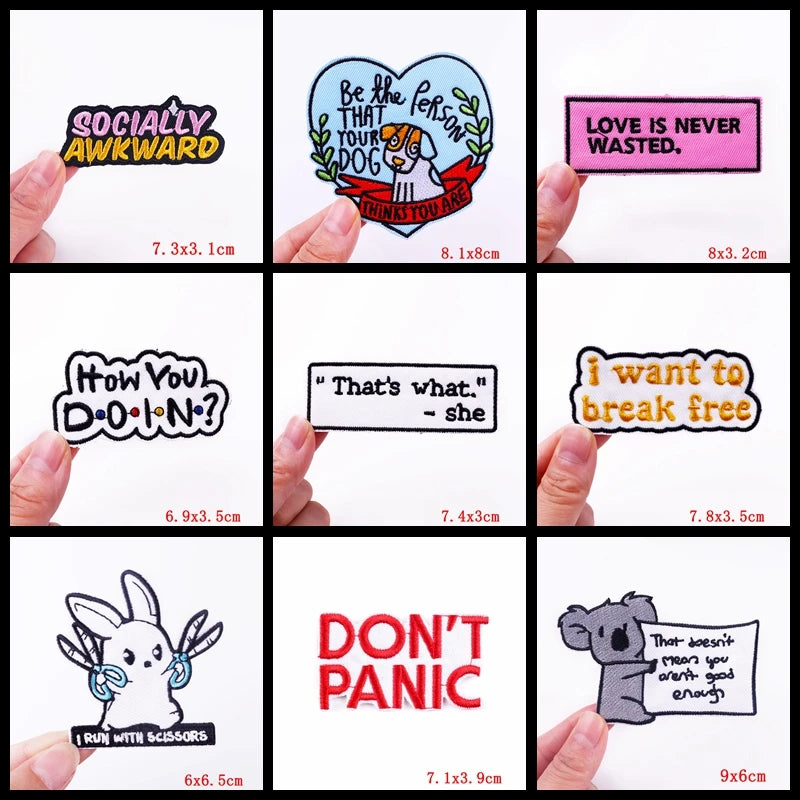 Collection of various stickers with different designs and text held by hands against a white background.