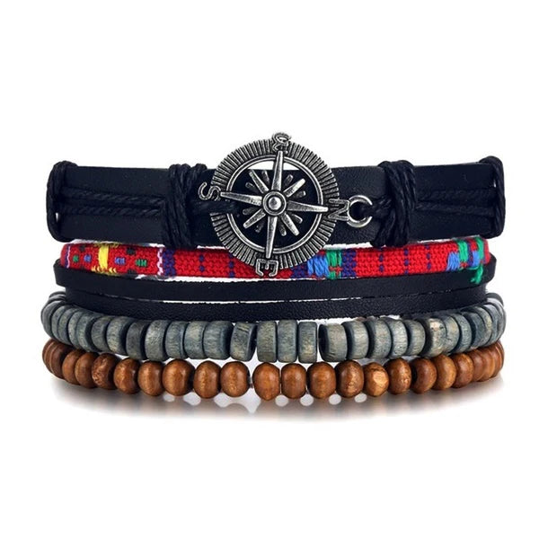 Stack of bracelets with a compass charm on a white background