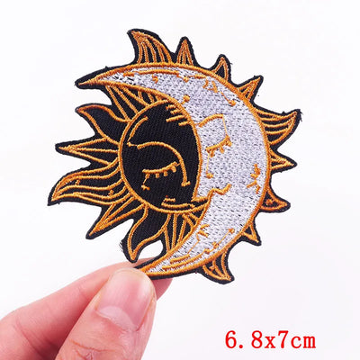 Embroidered patch of a sun and moon design held by a hand, with size '6.8x7cm' displayed.