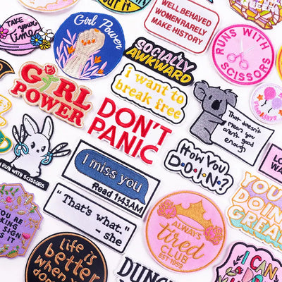 Collection of colorful stickers with various designs and text on a white background