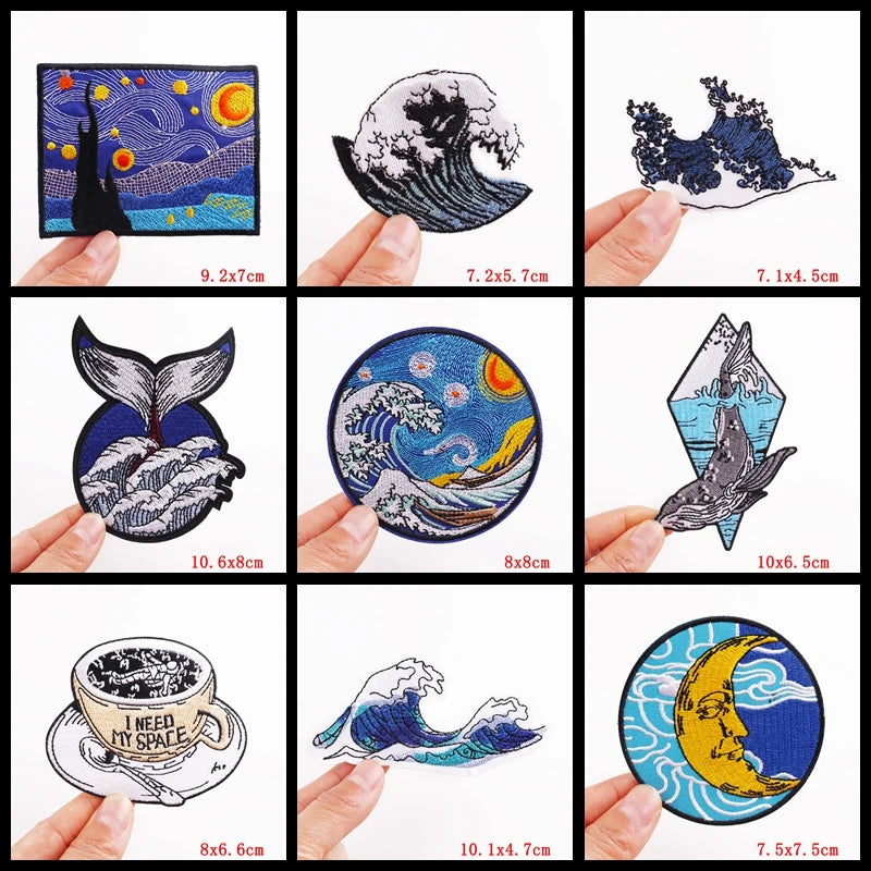 Collection of various artistic stickers held by hands with dimensions displayed.