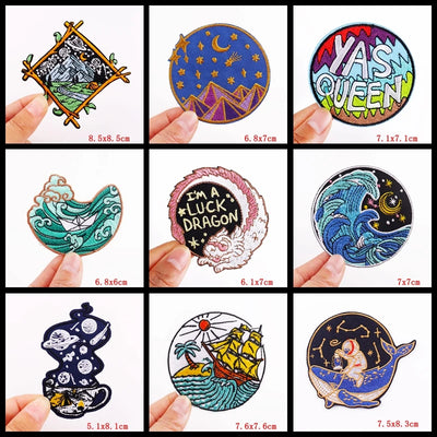 Collection of various decorative stickers held by hands with dimensions displayed.