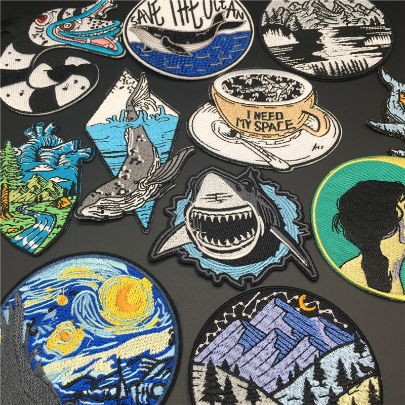 Collection of various embroidered patches on a dark background