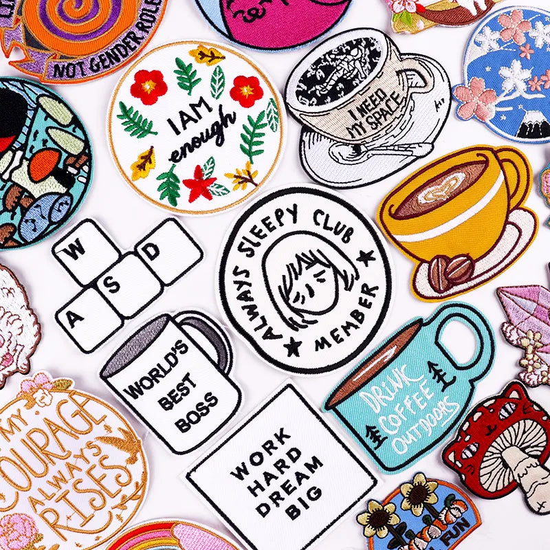 Collection of various colorful patches with different designs and text.
