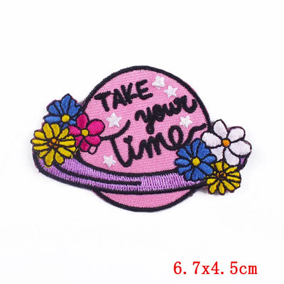 Pink patch with flowers and 'Take Your Time' text on a white background