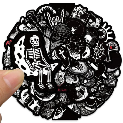 Circular sticker with black and white designs including skeletons and skulls held by a hand.