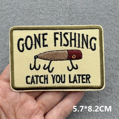 Embroidered patch with 'Gone Fishing, Catch You Later' text and fishing lure illustration on a gray background.