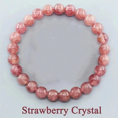 Strawberry crystal bracelet on a light gray background