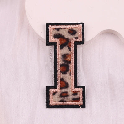 Letter 'I' patch with leopard print design on a white background