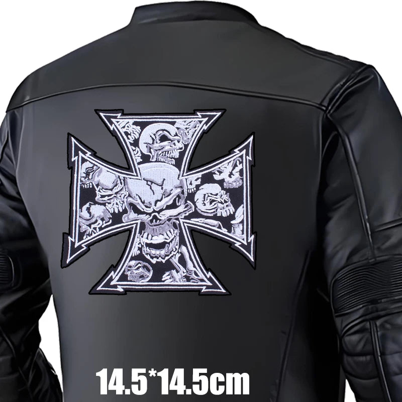 Black leather jacket with a large iron cross design on the back, featuring skulls and roses.