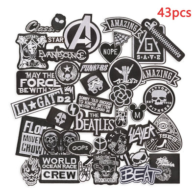 Collection of various black and white stickers with different designs and text on a white background.