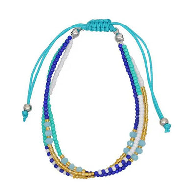 Set of colorful beaded bracelets on a white background