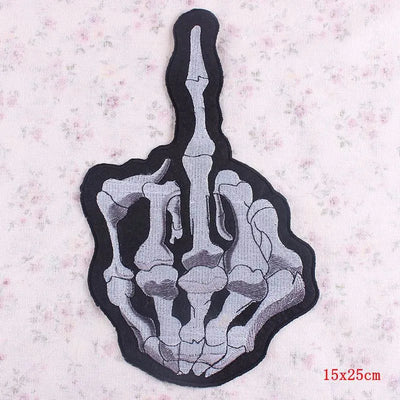 Skeleton hand with a middle finger gesture on a textured background