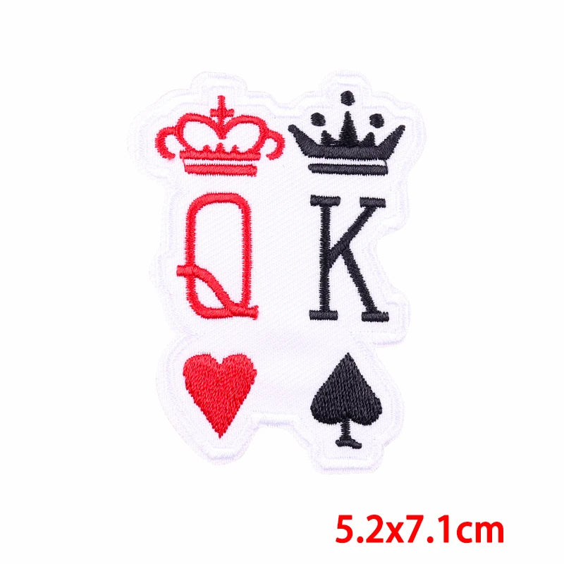 Embroidered patch with 'Q' and 'K' symbols on a white background